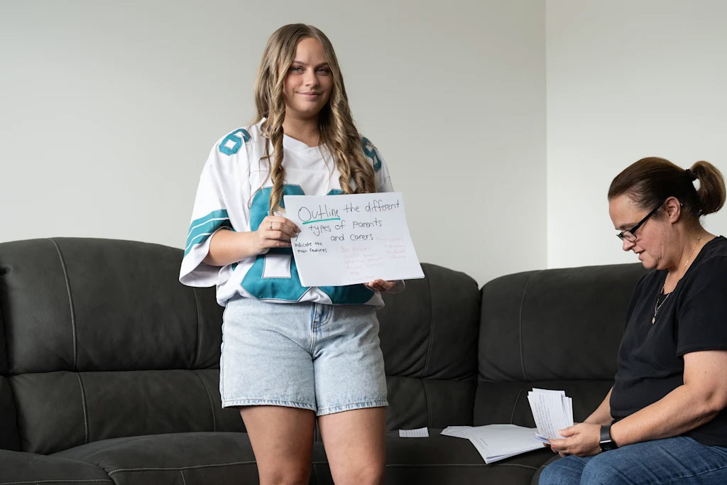 Shauna-Lee Young, from St Luke’s Catholic College in Marsden Park, studies by teaching her mum, Belinda, the content. Credit: Louie Douvis
