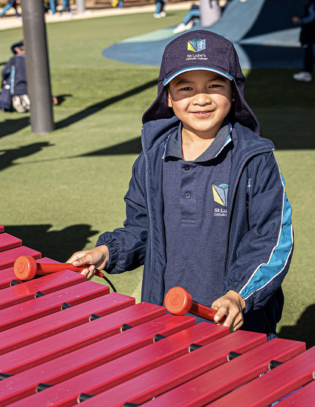 St Luke's Catholic School Marsden Park student playing on xylophone
