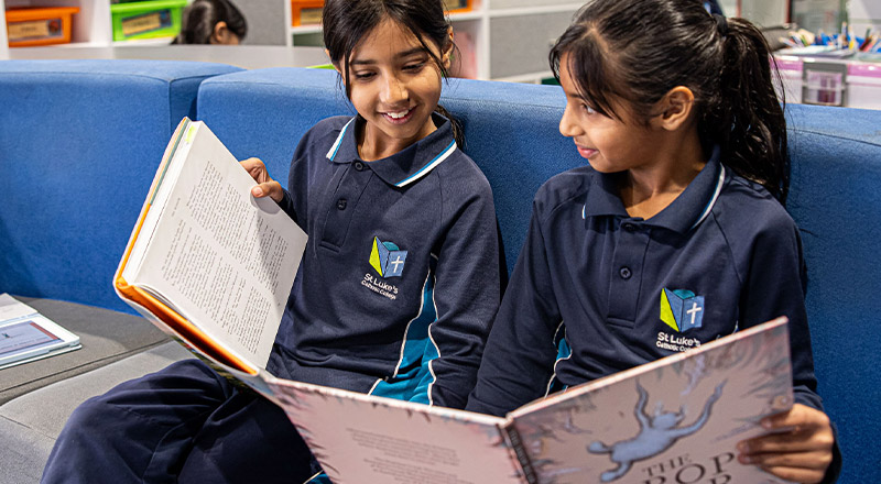 St Luke's Catholic School Marsden Park students reading book together