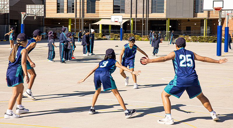 St Luke's Catholic School Marsden Park students playing basketball