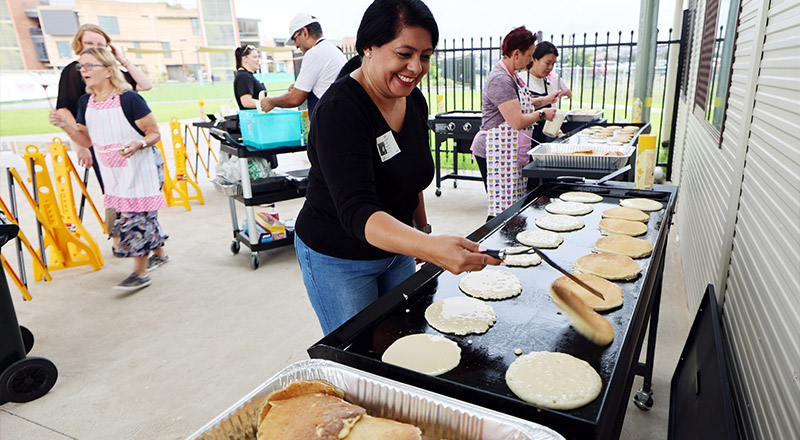 St Luke's Catholic School Marsden Park parent making pancakes