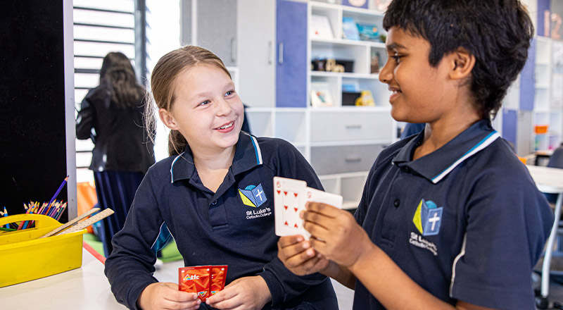 St Luke's Catholic School Marsden Park students playing a card game together