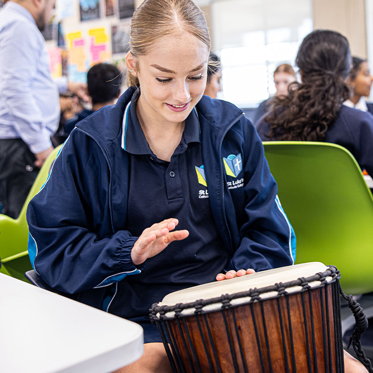 St Luke's Catholic School Marsden Park student playing drums