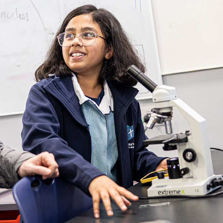St Luke's Catholic School Marsden Park student on microscope
